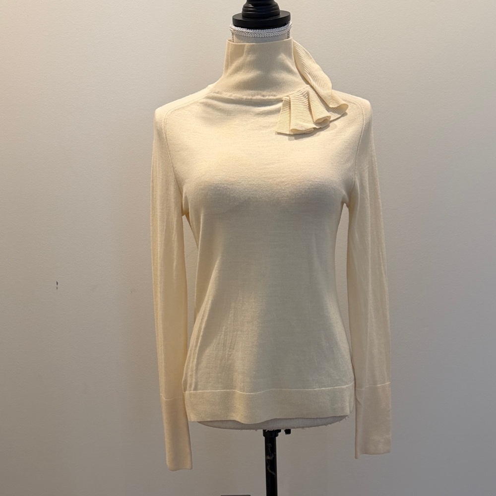 Magaschoni Cream Turtleneck Sweater with Ruffle Accent